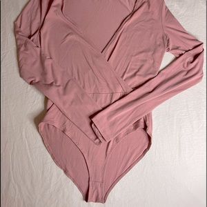 Pink long sleeve body suit